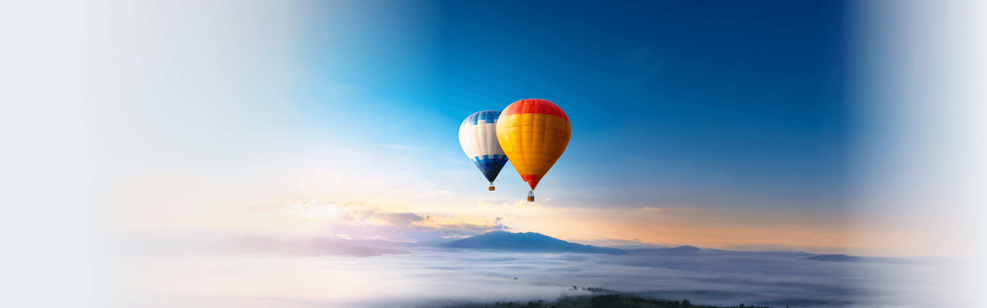 Hot air balloon over sea of mist