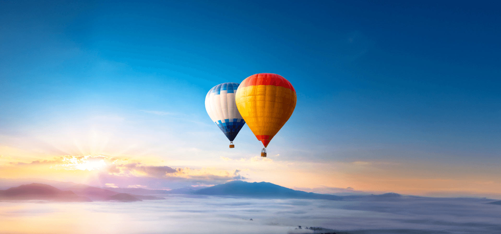 Hot air balloon over sea of mist